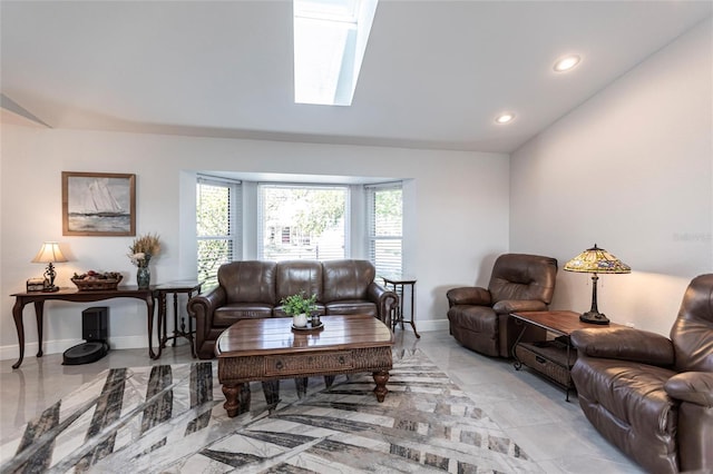 living room featuring a skylight