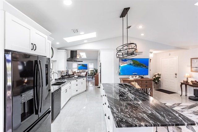 kitchen with white cabinetry, decorative light fixtures, sink, and black appliances