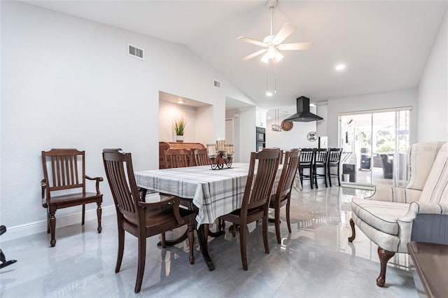 dining area with vaulted ceiling and ceiling fan