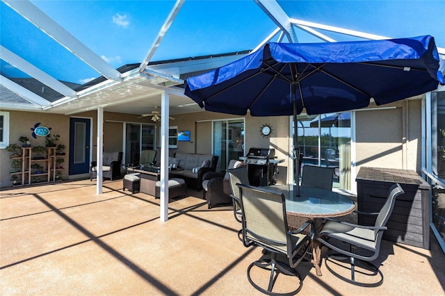 view of patio / terrace with ceiling fan, an outdoor living space, a lanai, and area for grilling