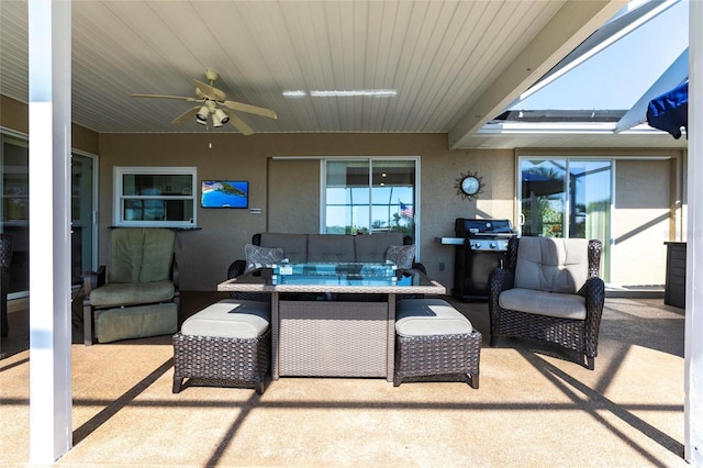 view of patio / terrace featuring ceiling fan, an outdoor living space, and grilling area