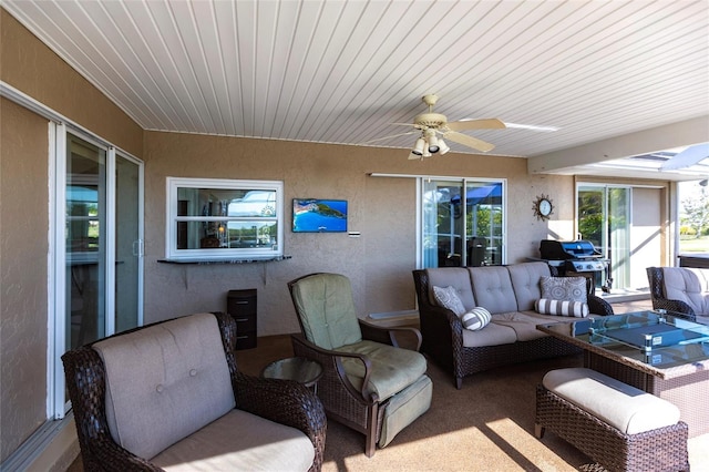 view of patio / terrace featuring area for grilling, an outdoor hangout area, and ceiling fan