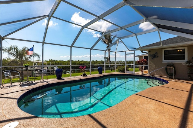 view of pool with a lanai and a patio area