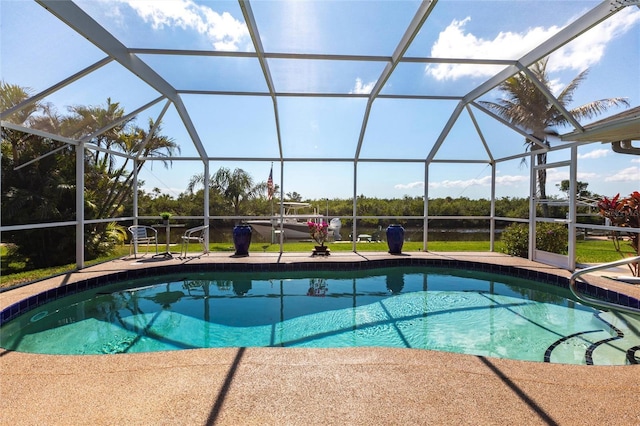 view of swimming pool with a lanai and a patio area