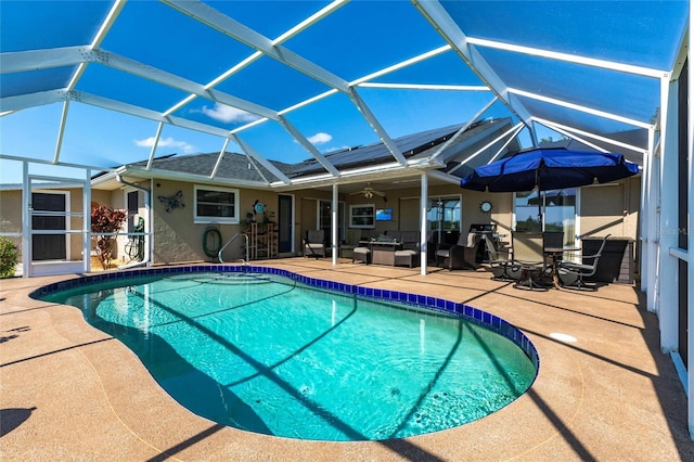 view of swimming pool featuring a lanai and a patio area