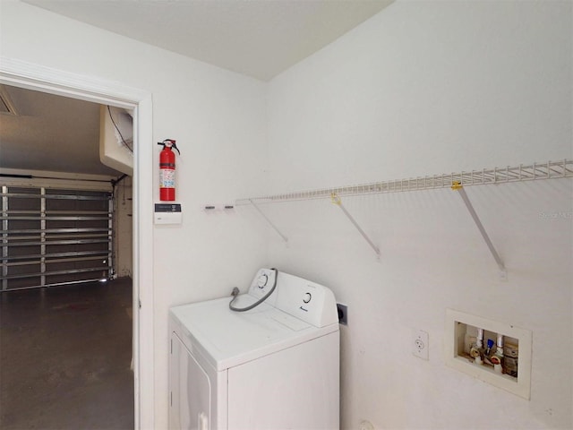 clothes washing area featuring washer / clothes dryer