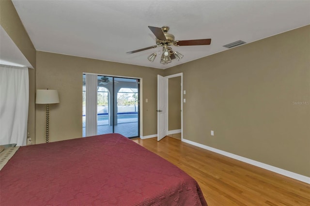295 Porto Alegre St, Punta Gorda, FL 33983 - unfurnished bedroom featuring access to exterior, wood-type flooring, and ceiling fan