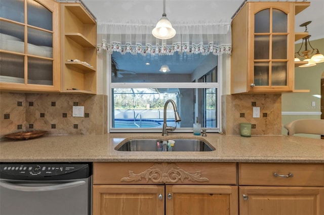 295 Porto Alegre St, Punta Gorda, FL 33983 - kitchen with sink, tasteful backsplash, decorative light fixtures, dishwashing machine, and light stone countertops