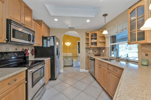 295 Porto Alegre St, Punta Gorda, FL 33983 - kitchen with appliances with stainless steel finishes, light stone counters, and decorative light fixtures