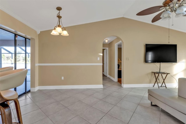 295 Porto Alegre St, Punta Gorda, FL 33983 - interior space with light tile patterned flooring, lofted ceiling, crown molding, and ceiling fan with notable chandelier