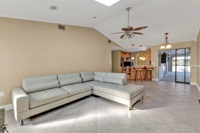 295 Porto Alegre St, Punta Gorda, FL 33983 - living room with vaulted ceiling, light tile patterned floors, ceiling fan, and crown molding