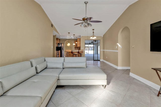 295 Porto Alegre St, Punta Gorda, FL 33983 - living room with light tile patterned floors, vaulted ceiling, and ceiling fan