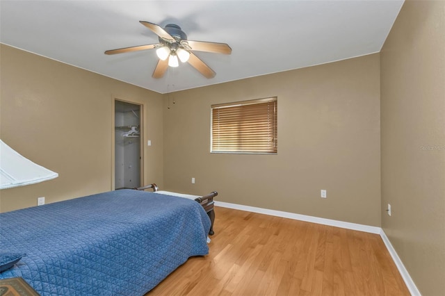 295 Porto Alegre St, Punta Gorda, FL 33983 - bedroom with a walk in closet, light hardwood / wood-style flooring, and ceiling fan