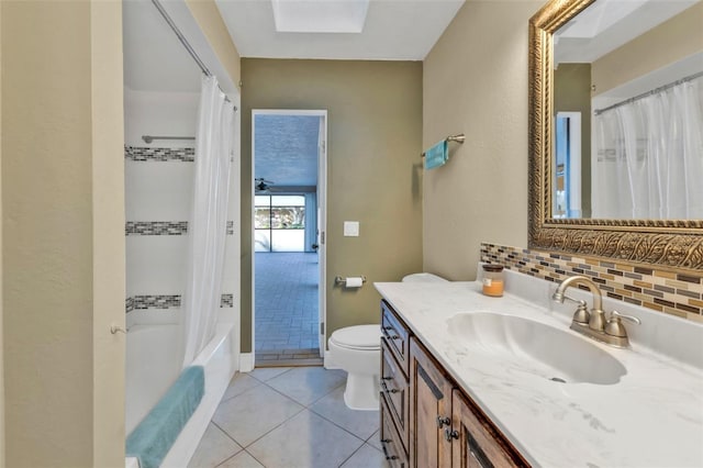 295 Porto Alegre St, Punta Gorda, FL 33983 - full bathroom featuring shower / tub combo, vanity, decorative backsplash, tile patterned floors, and toilet