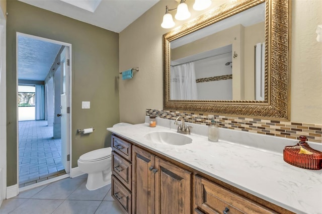 295 Porto Alegre St, Punta Gorda, FL 33983 - bathroom featuring backsplash, tile patterned flooring, vanity, toilet, and a shower with curtain