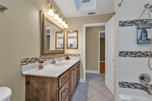 295 Porto Alegre St, Punta Gorda, FL 33983 - full bathroom featuring tile patterned floors, toilet, tasteful backsplash, tiled shower / bath, and vanity