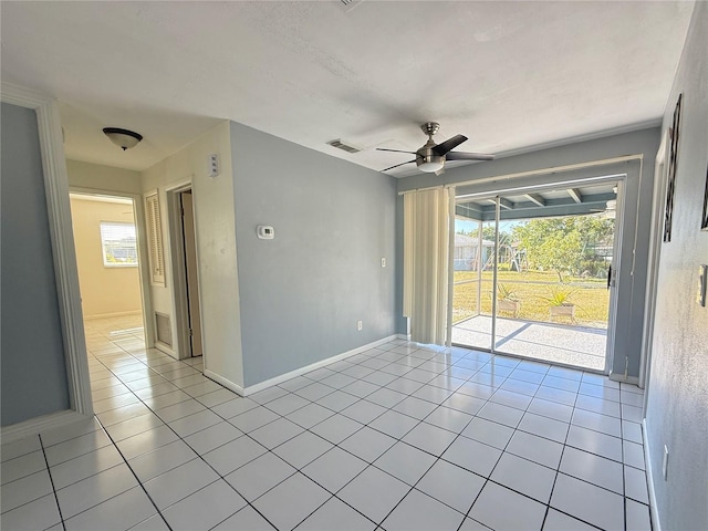 tiled empty room with ceiling fan