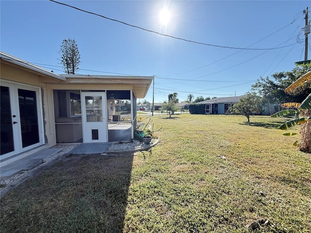 view of yard featuring a sunroom