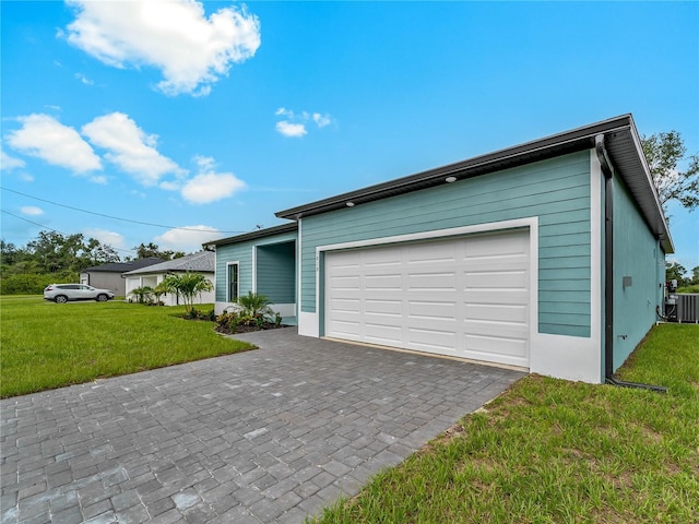 1818 New London St, North Port, FL 34288 - view of front of property with a front lawn, decorative driveway, and an attached garage