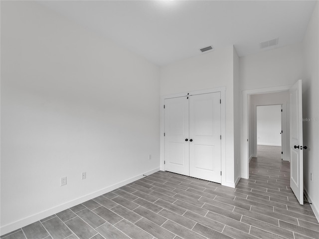 1818 New London St, North Port, FL 34288 - unfurnished bedroom with wood finished floors and a closet