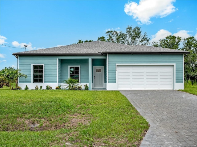 1818 New London St, North Port, FL 34288 - ranch-style home with a garage, a front yard, and decorative driveway