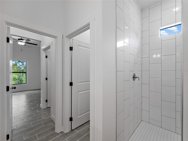 1818 New London St, North Port, FL 34288 - bathroom with a tile shower, ceiling fan, and wood tiled floors
