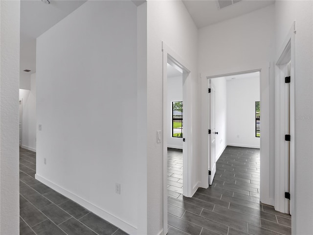 1818 New London St, North Port, FL 34288 - hallway featuring baseboards and dark wood finished floors
