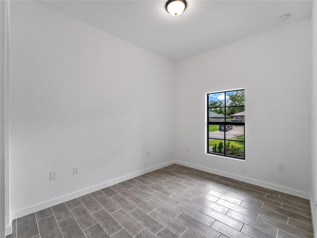 1818 New London St, North Port, FL 34288 - unfurnished room featuring dark wood-type flooring and a smoke detector