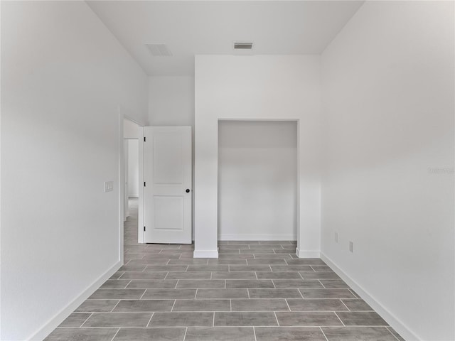 1818 New London St, North Port, FL 34288 - unfurnished bedroom with baseboards and wood finished floors
