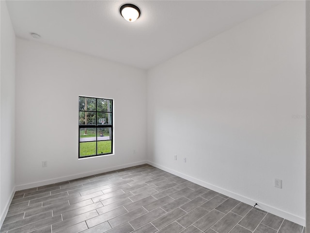 1818 New London St, North Port, FL 34288 - unfurnished room featuring wood tiled floors and a smoke detector