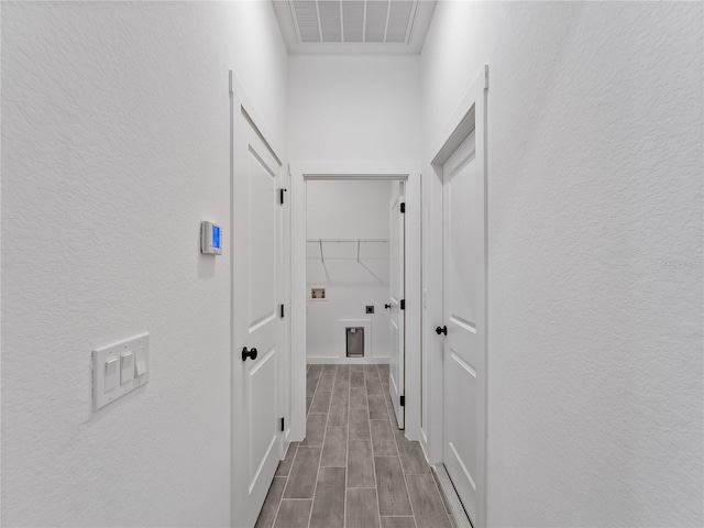 1818 New London St, North Port, FL 34288 - corridor featuring a textured wall and wood tiled floors
