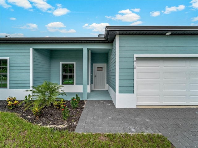 1818 New London St, North Port, FL 34288 - view of exterior entry featuring a garage