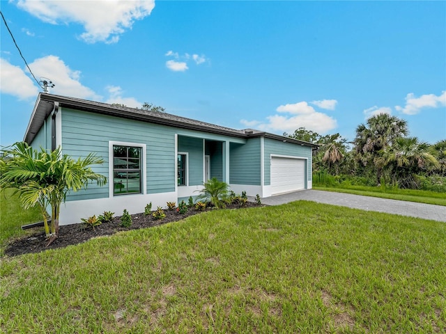 1818 New London St, North Port, FL 34288 - view of front of property with driveway, a garage, and a front lawn