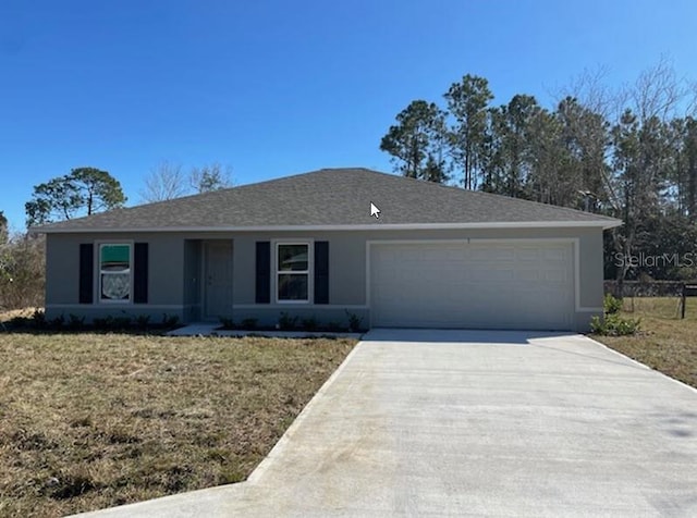 single story home featuring a front yard and a garage