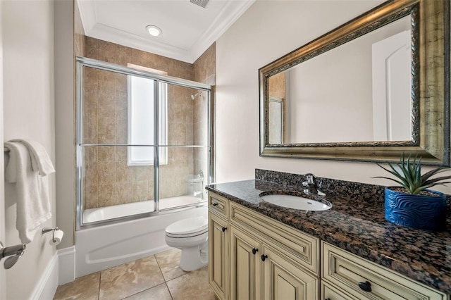 full bathroom featuring vanity, crown molding, enclosed tub / shower combo, and toilet