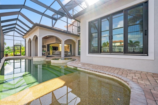 view of pool with a patio and a lanai