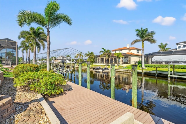 view of dock with a water view and a lanai