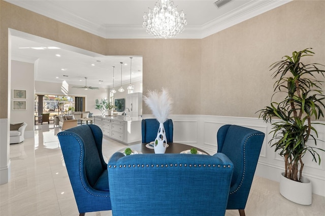 dining space featuring crown molding and ceiling fan with notable chandelier