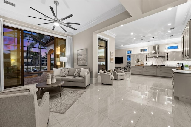 living room featuring crown molding and ceiling fan