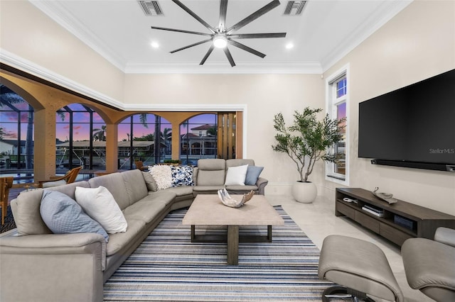 living room featuring ornamental molding and ceiling fan