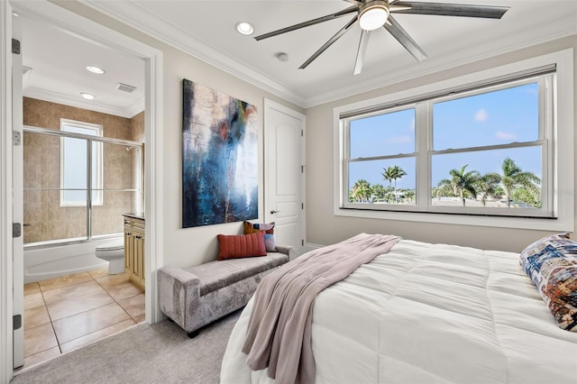 tiled bedroom featuring crown molding, connected bathroom, and ceiling fan