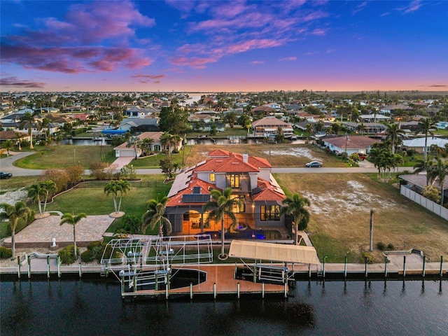 aerial view at dusk with a water view