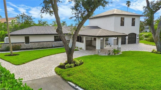 view of front facade featuring a garage and a front yard