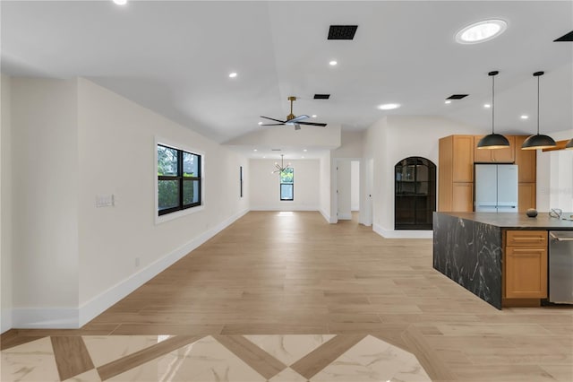 kitchen featuring white fridge, lofted ceiling, light wood-type flooring, pendant lighting, and dishwasher