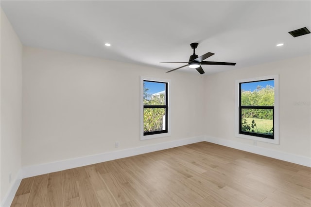 unfurnished room featuring light wood-type flooring and ceiling fan