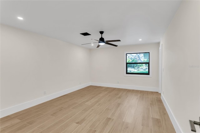 spare room featuring light hardwood / wood-style flooring and ceiling fan