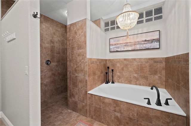 bathroom with independent shower and bath and a chandelier