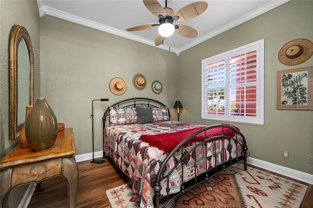 bedroom with crown molding, ceiling fan, and dark wood-type flooring