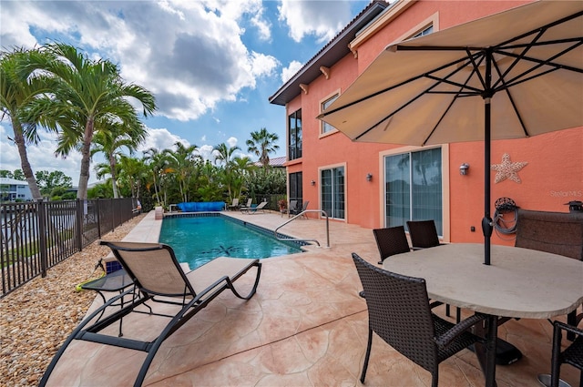 view of swimming pool featuring a patio area