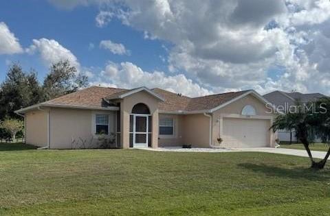 ranch-style home featuring a garage, a front yard, driveway, and stucco siding